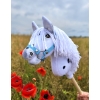 white hobby horse with mouth open